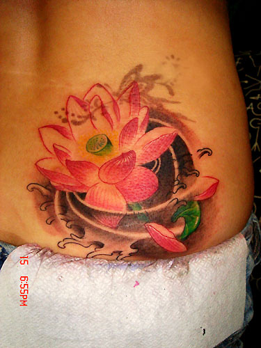 Pink Ink Lotus Flower In Water Tattoo On Lower Back