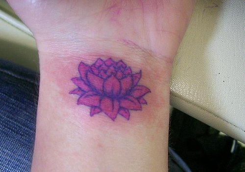 Pink Ink Lotus Flower Tattoo On Left Wrist