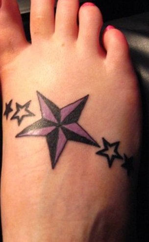 Purple And Black Nautical Star Tattoo On Right Foot