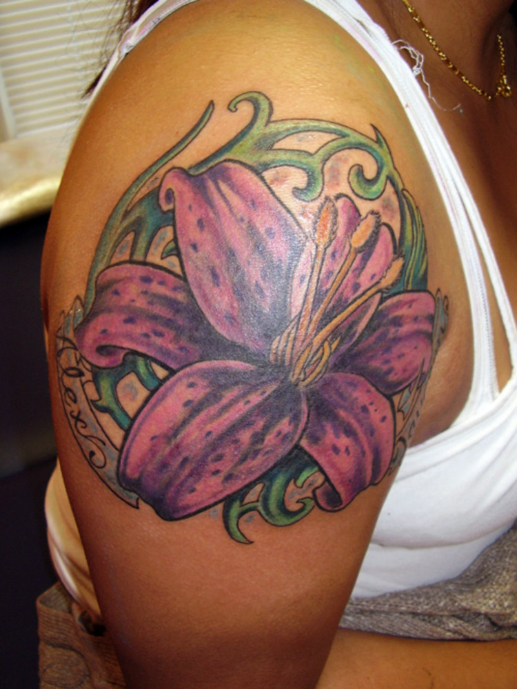 Purple Ink Lily Flower With Banner Tattoo On Women Right Shoulder