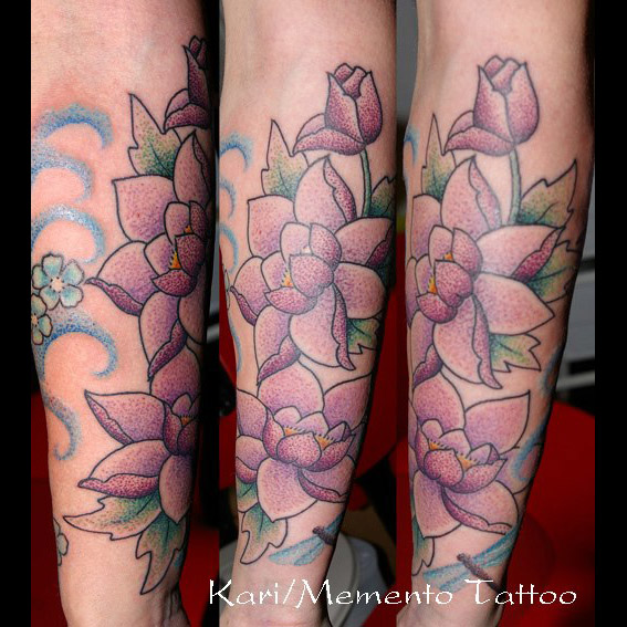 Purple Ink Lotus Flowers Tattoo On Left Sleeve