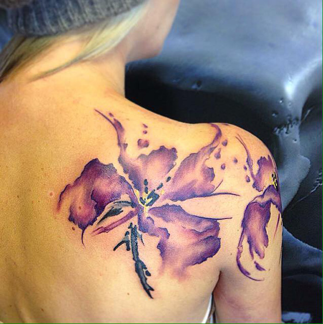 Purple Ink Watercolor Lily Tattoo On Right Back Shoulder