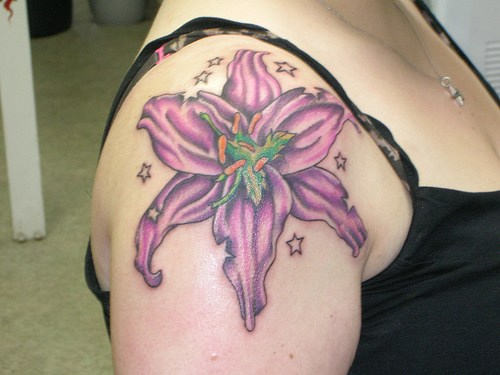 Purple Lily Tattoo On Girl Right Shoulder