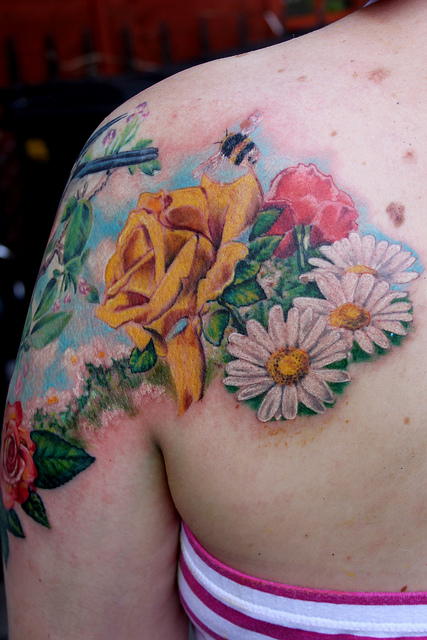 Realistic Bumblebee With Flowers Tattoo On Left Back Shoulder