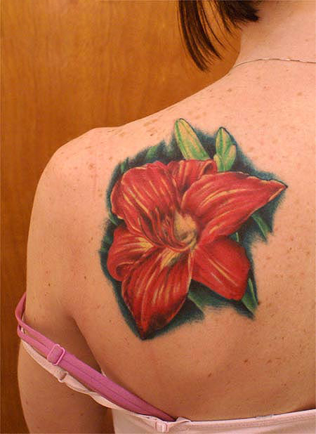 Red Ink Lily Flower Tattoo On Girl Left Back Shoulder