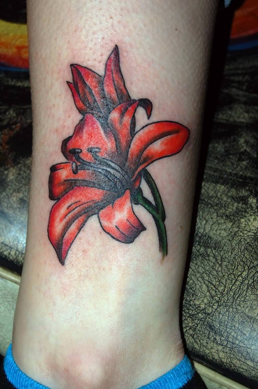 Red Ink Lily Flower Tattoo On Leg