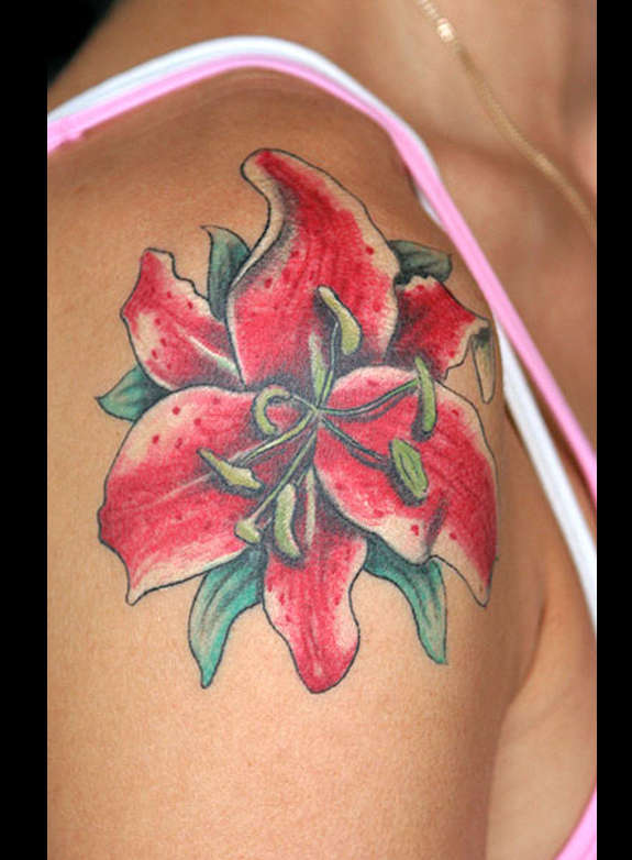 Red Ink Lily Flower Tattoo On Women Right Shoulder