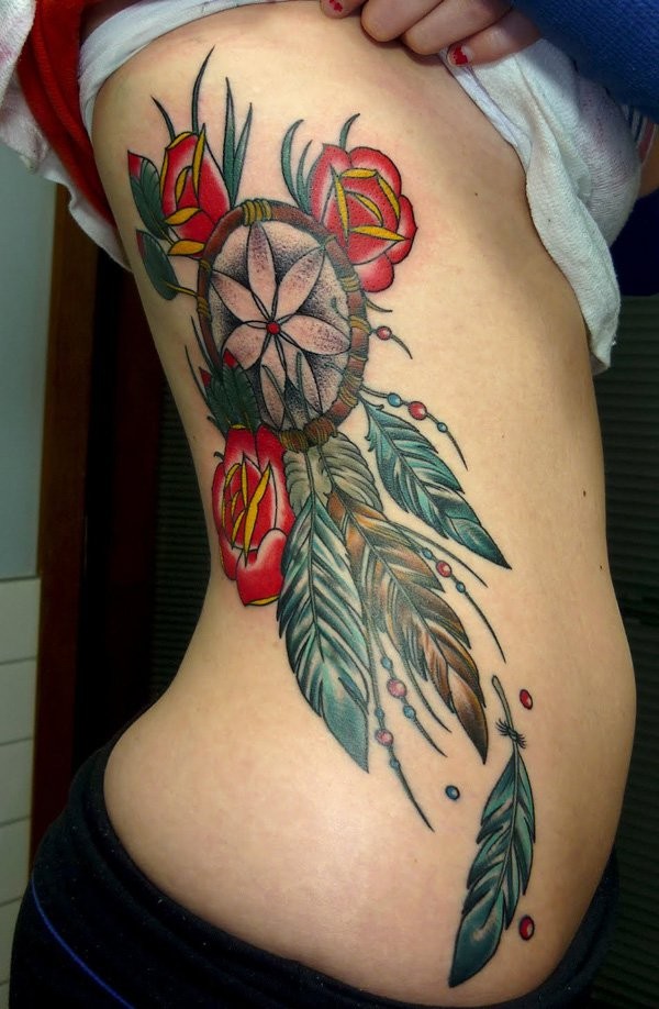 Red Rose Flowers And Dreamcatcher Tattoo On Girl Rib Side