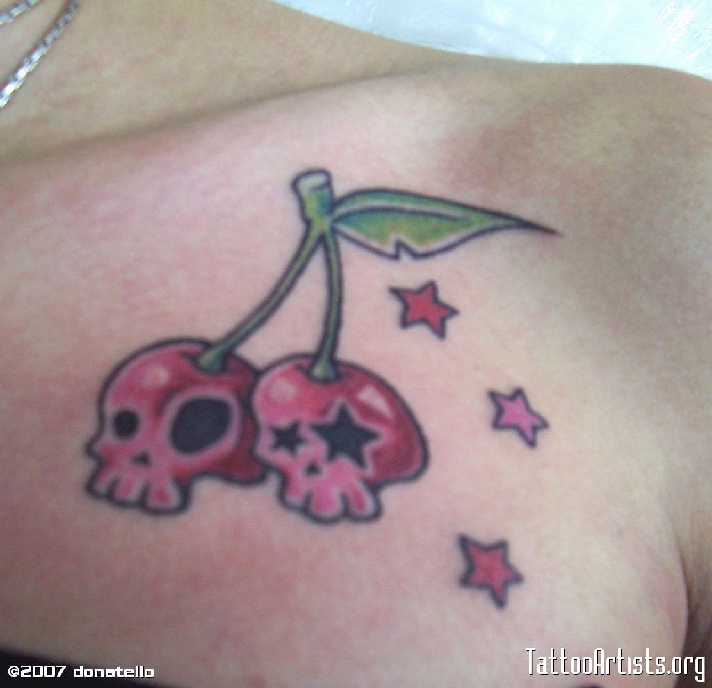 Red Stars and Cherry Skulls Tattoo On Front Shoulder