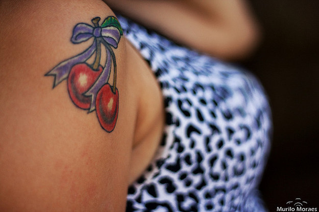 Right Shoulder Purple Bow And Cherry Tattoo Idea For Girls