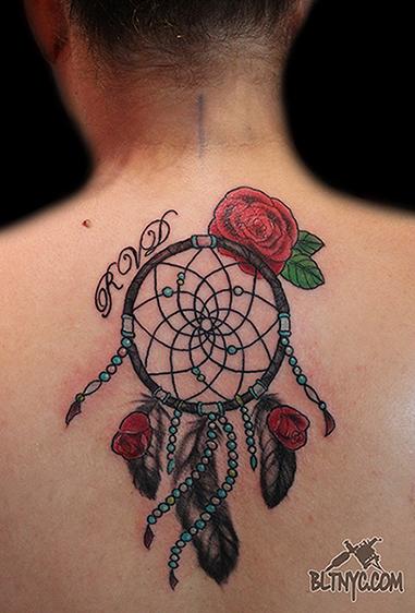 Rose Flowers And Dreamcatcher Tattoo On Girl Upper Back