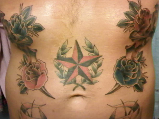 Rose Flowers And Nautical Star Tattoos On Stomach