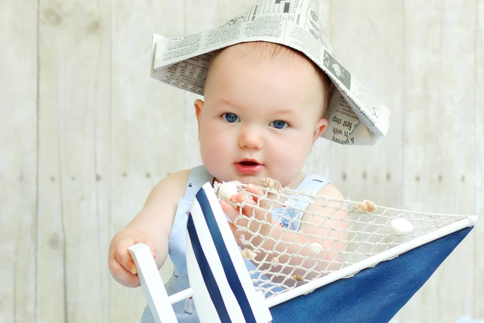Sailor Baby Wearing Newspaper Cap Funny Picture