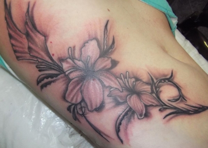 Side Rib Black And Grey Lily Tattoo For Young Girls