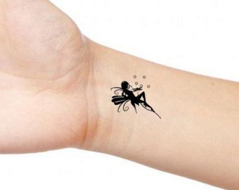 Silhouette Fairy Tattoo On Right Wrist