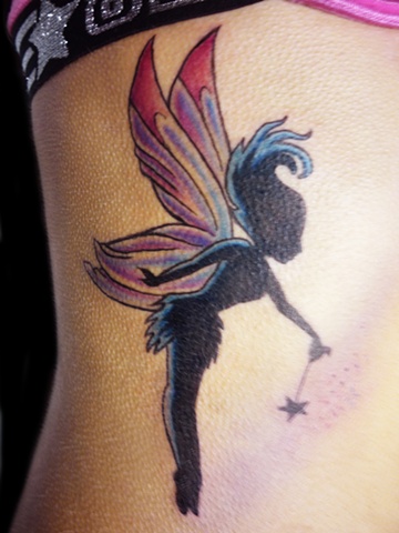 Silhouette Fairy With Magic Stick Tattoo On Girl Right Side Rib