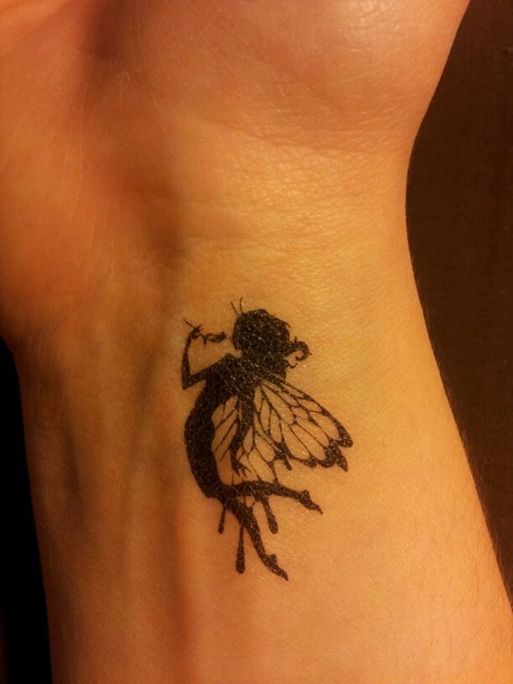Silhouette Flying Fairy Tattoo Design For Wrist
