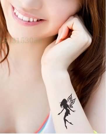Silhouette Flying Fairy Tattoo On Girl Left Side Wrist