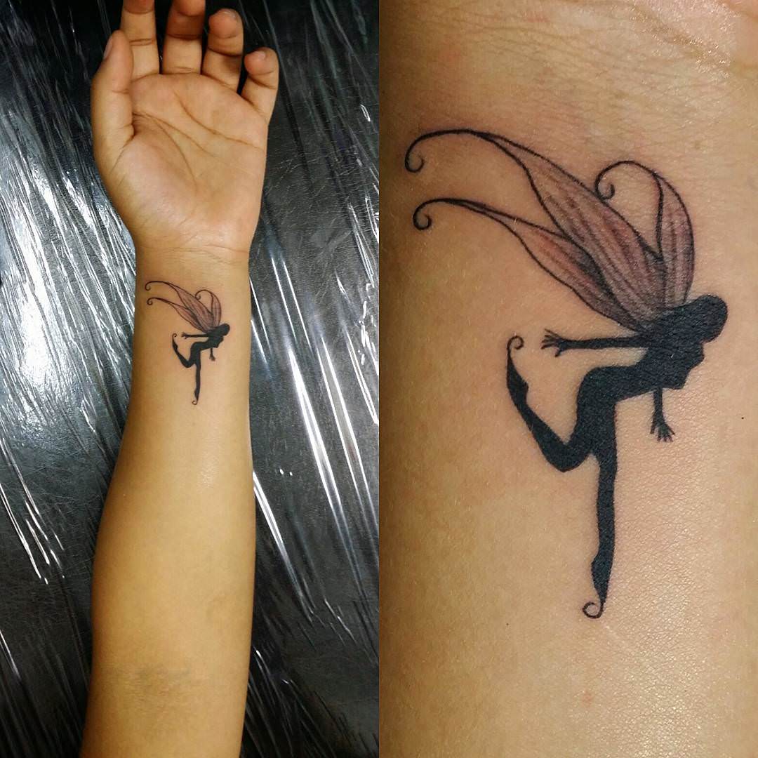 Silhouette Flying Fairy Tattoo On Left Wrist