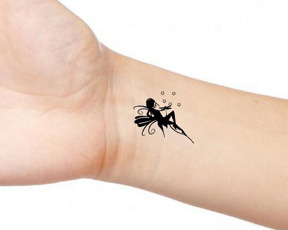 Silhouette Small Fairy Stars Tattoo On Wrist