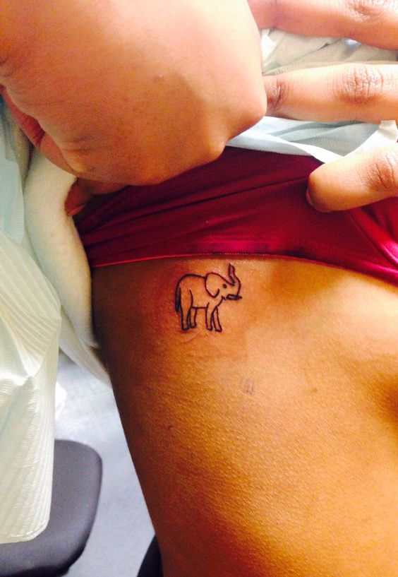 Simple Black Outline Elephant Tattoo On Girl Right Side Rib