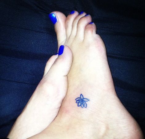 Simple Black Outline Lotus Flower Tattoo On Girl Right Foot