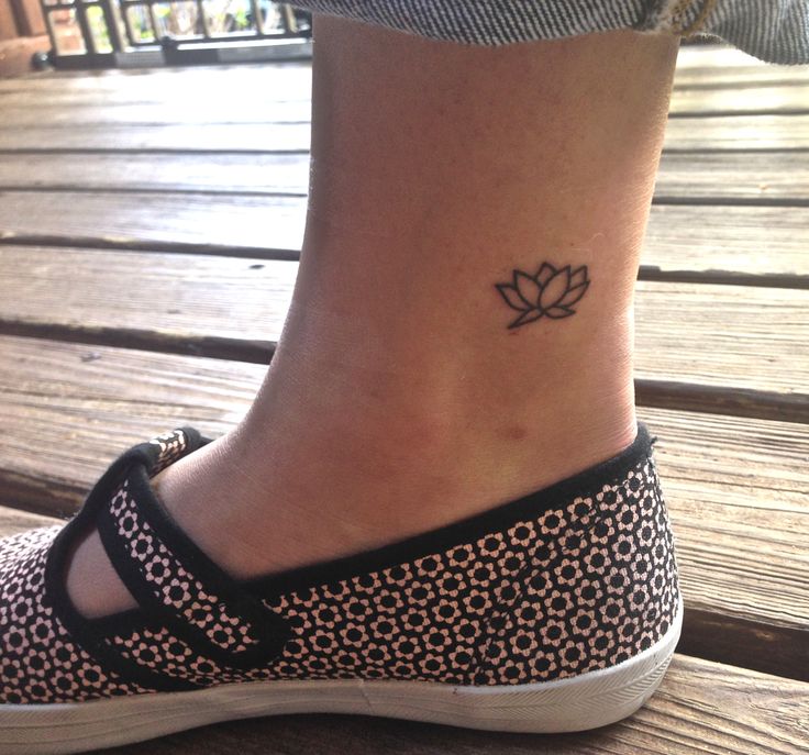 Simple Black Outline Lotus Flower Tattoo On Right Foot Ankle