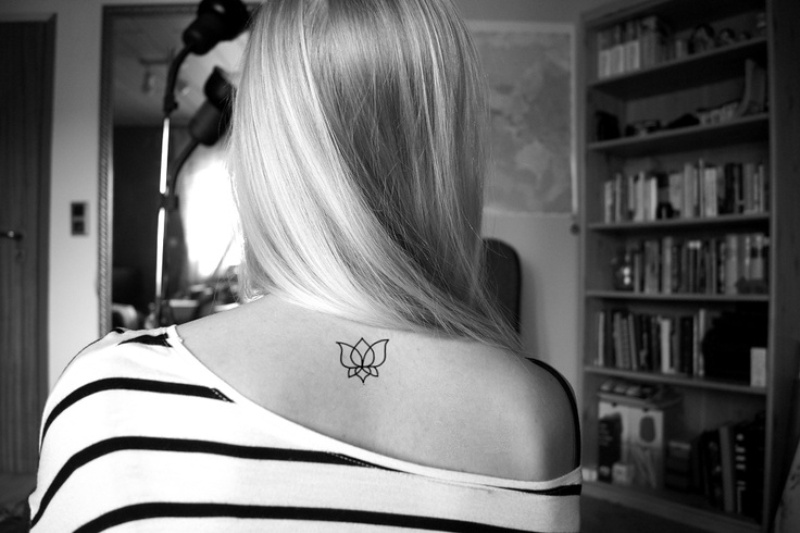 Simple Black Outline Lotus Tattoo On Girl Back Neck
