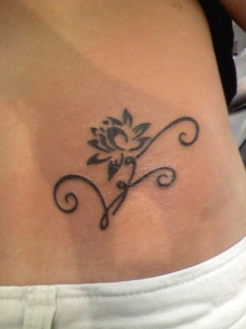 Simple Black Tribal Lotus Tattoo On Lower Back
