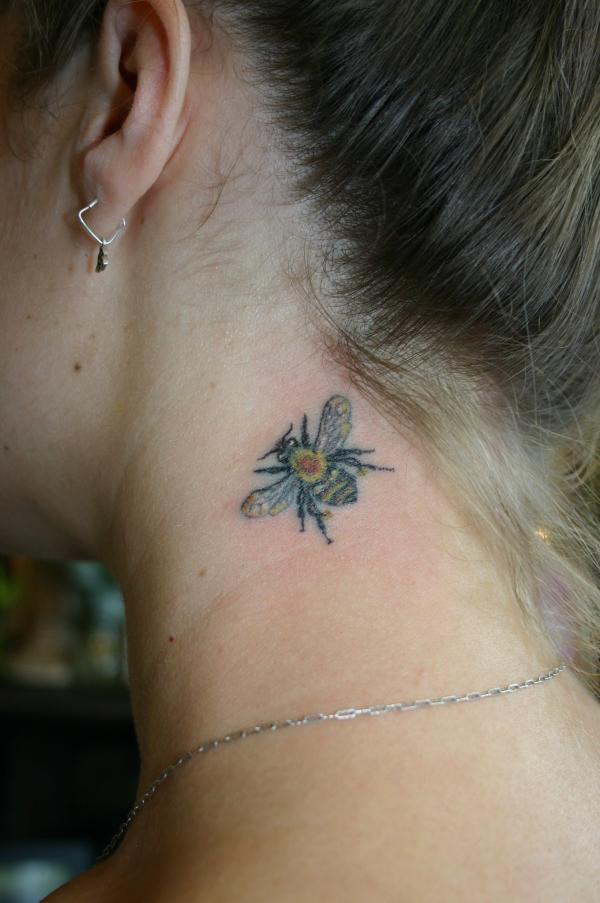 Simple Bumblebee Tattoo On Girl Side Neck