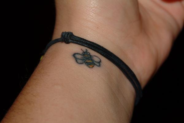 Simple Bumblebee Tattoo On Left Wrist