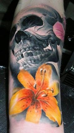 Skull And Yellow Lilly Tattoo On Sleeve