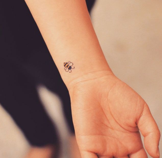 Small Bumblebee Tattoo On Left Wrist