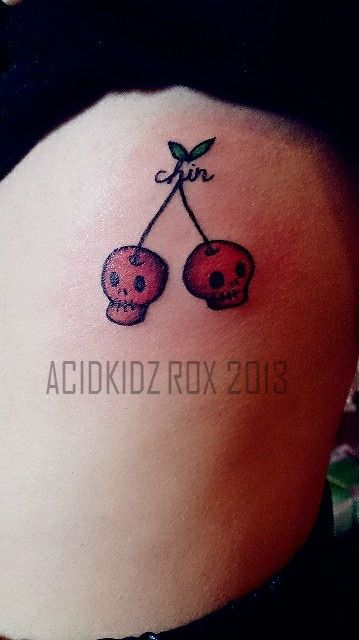 Small Cherry Skull Tattoo On Side Rib