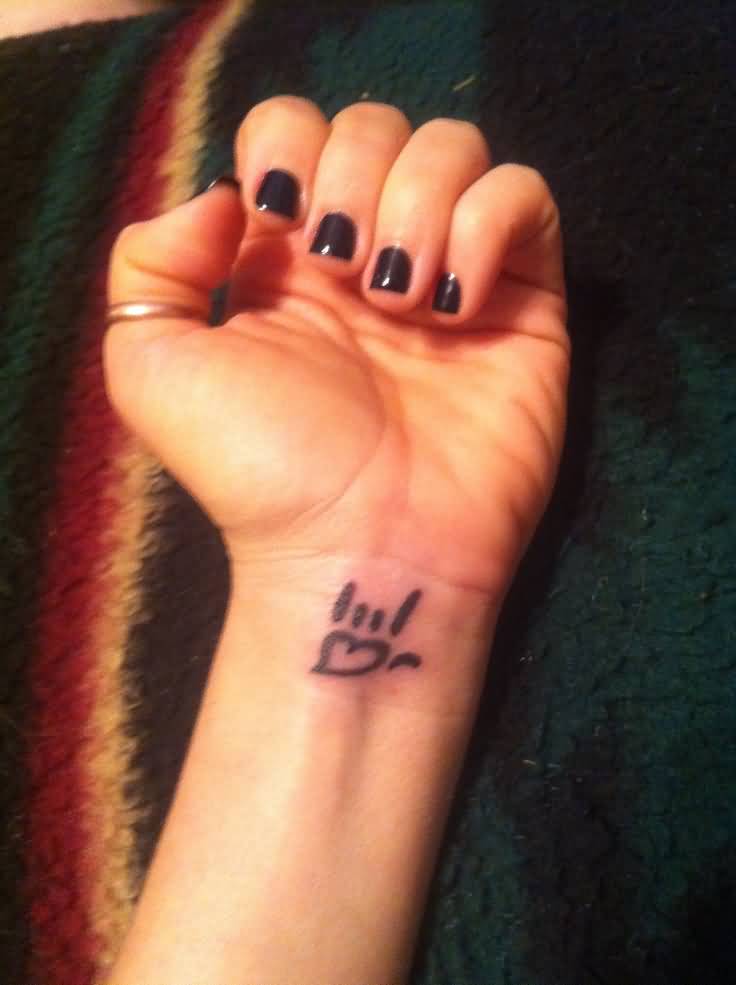 Small I Love You Symbol Tattoo On Girl Left Wrist