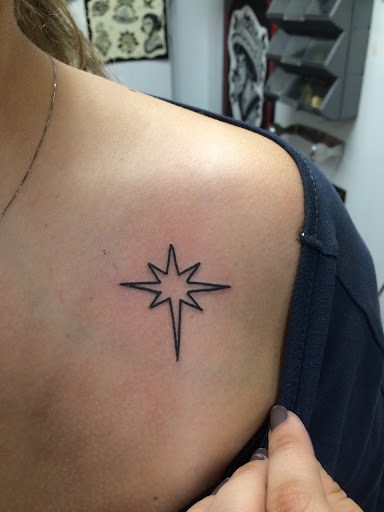 Small Outline Star Tattoo On Front Shoulder