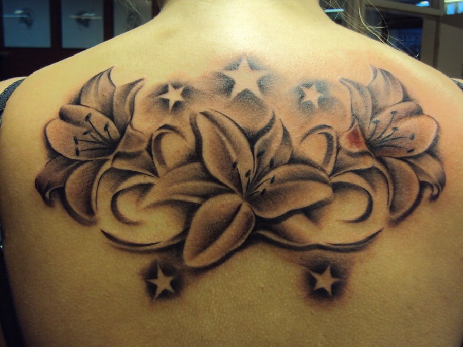 Stars And Black And Grey Lily Tattoo On Upper Back