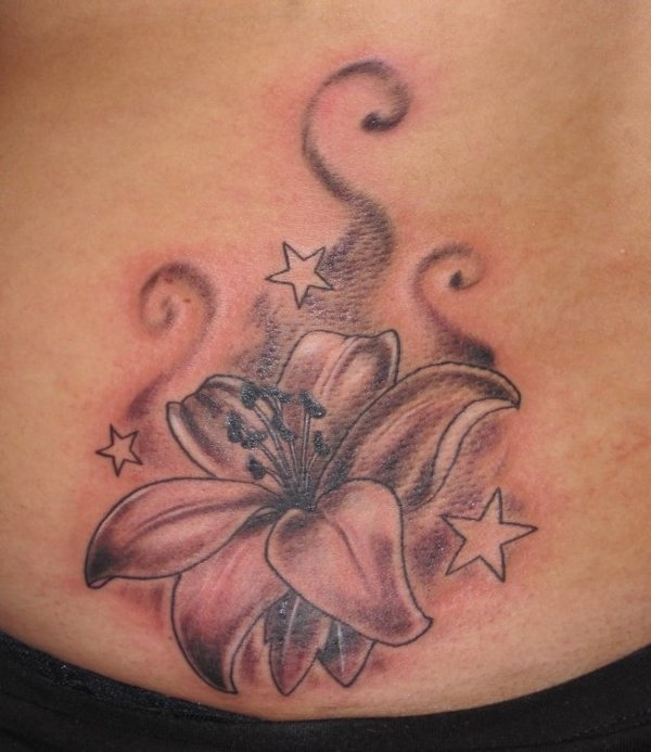 Stars And Lily Tattoo On Lower Back
