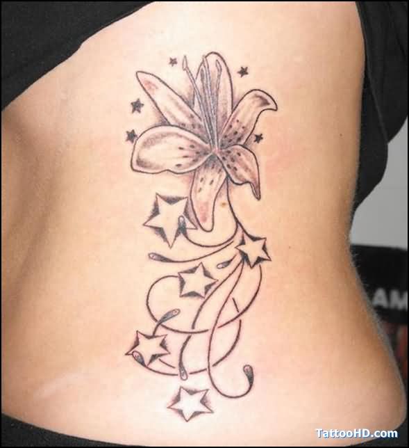 Tiger Lily And Stars Tattoo On Girl Side Rib
