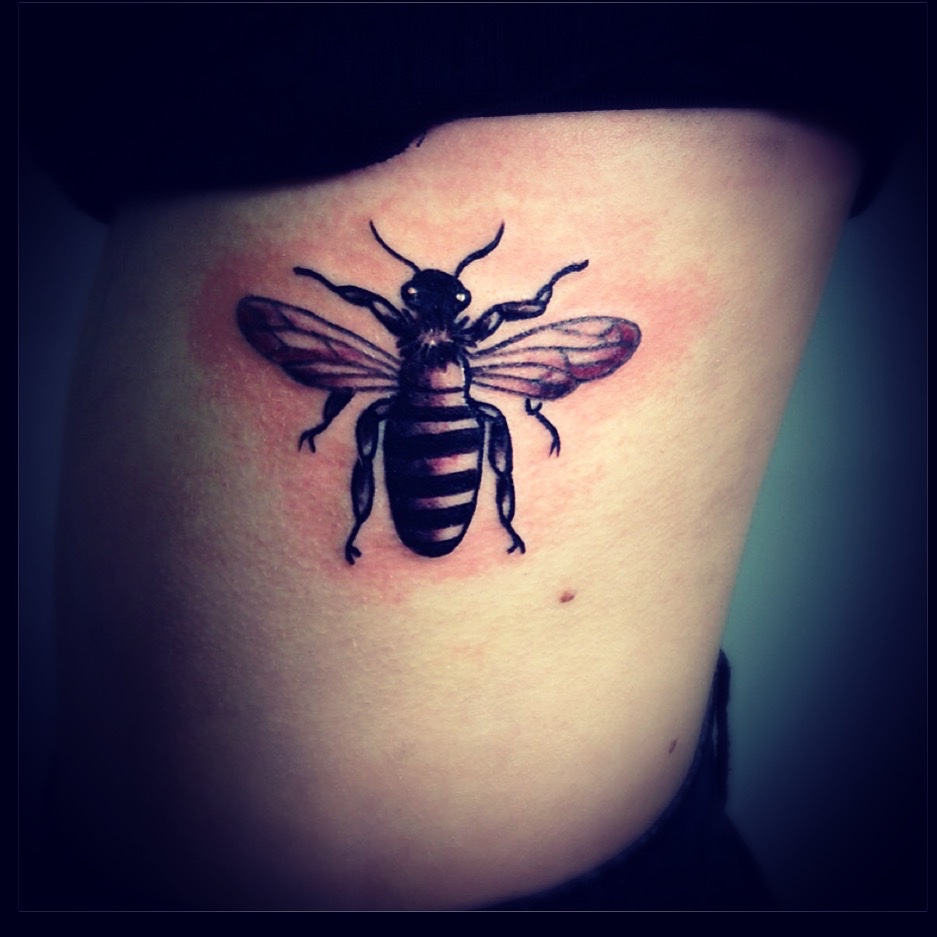 Traditional Bumblebee Tattoo On Girl Left Side Rib