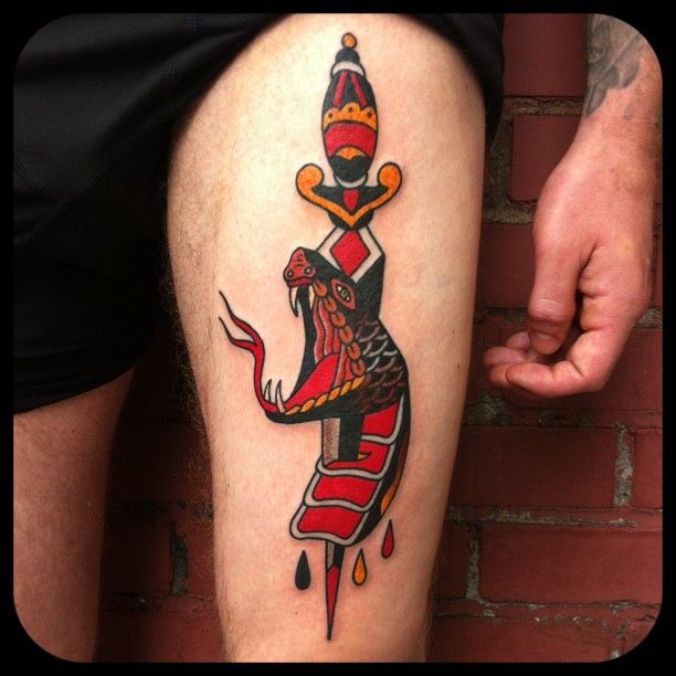 Traditional Dagger In Snake Head Tattoo On Left Thigh