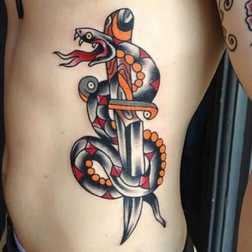 Traditional Dagger With Snake Tattoo On Man Left Side Rib