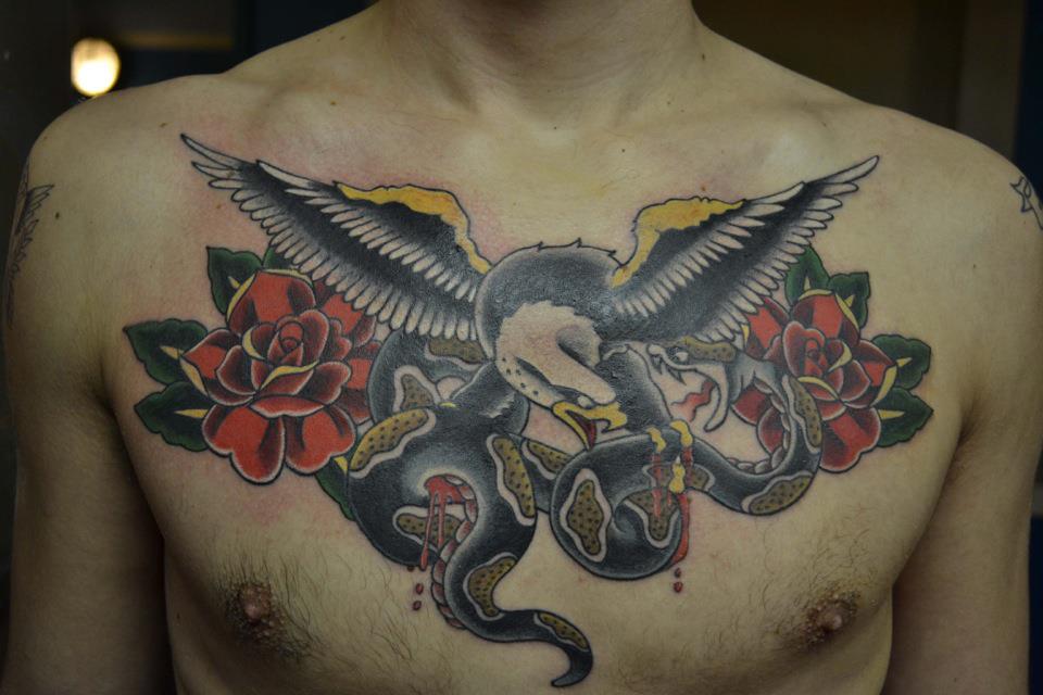Traditional Eagle With Snake And Roses Tattoo On Man Chest