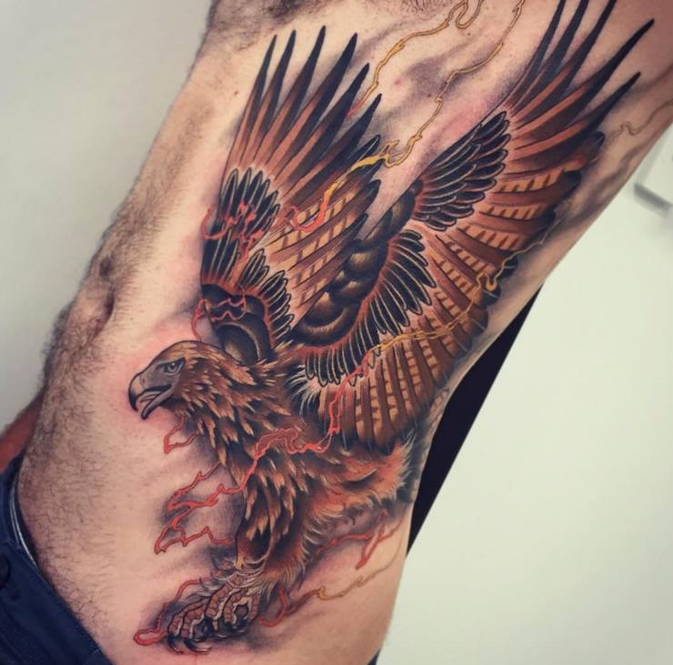 Traditional Flying Eagle Tattoo On Man Left Side Rib By Tom Bartley