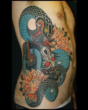 Traditional Japanese Snake With Hannya Head And Flowers Tattoo On Right Side Rib