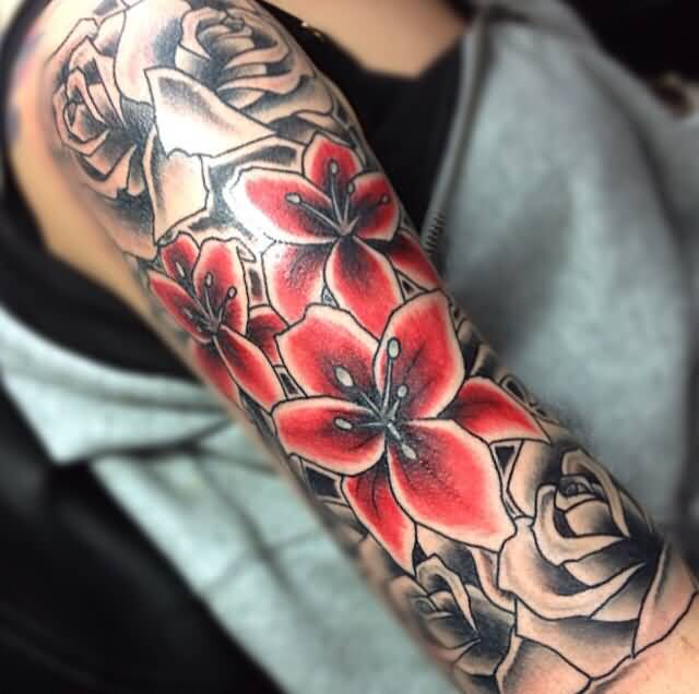 Traditional Lily Flowers Tattoo On Right Upper Arm