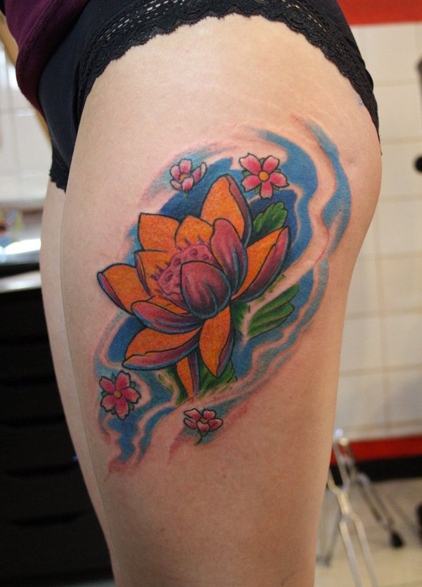 Traditional Lotus Flower Tattoo On Girl Left Side Thigh By Ian