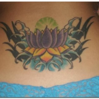 Traditional Lotus Flower Tattoo On Girl Lower Back