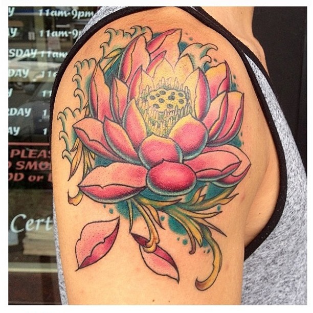 Traditional Lotus Flower Tattoo On Man Right Shoulder