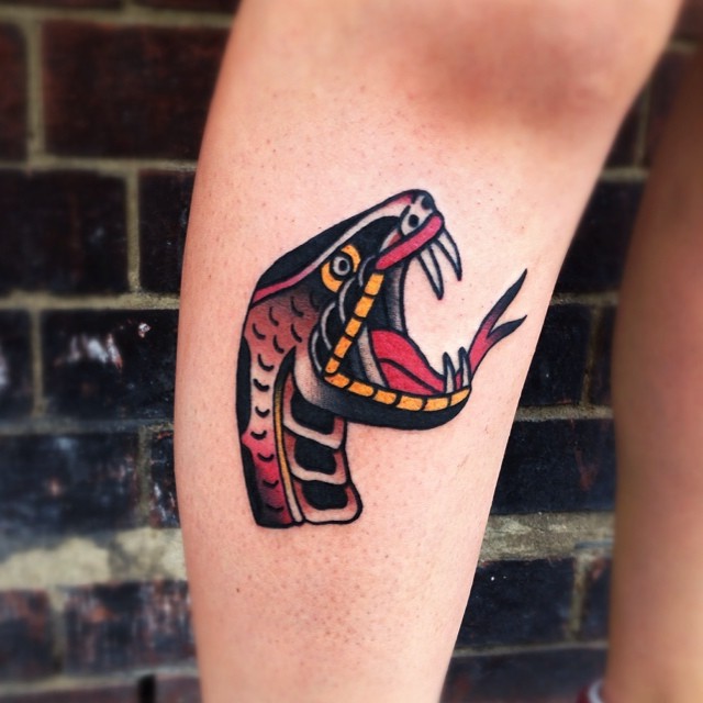Traditional Snake Head Tattoo On Left Leg Calf